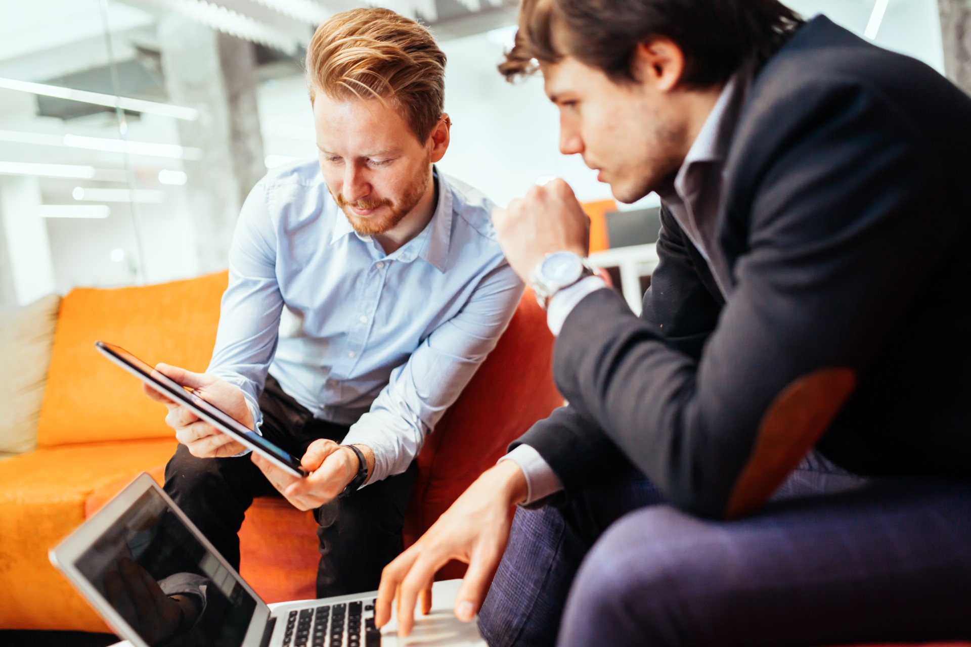 People meeting with laptop and tablet