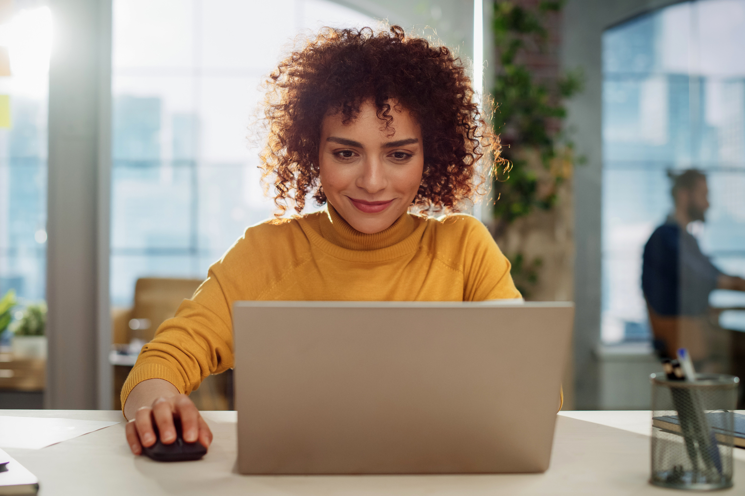Confident woman working on computer