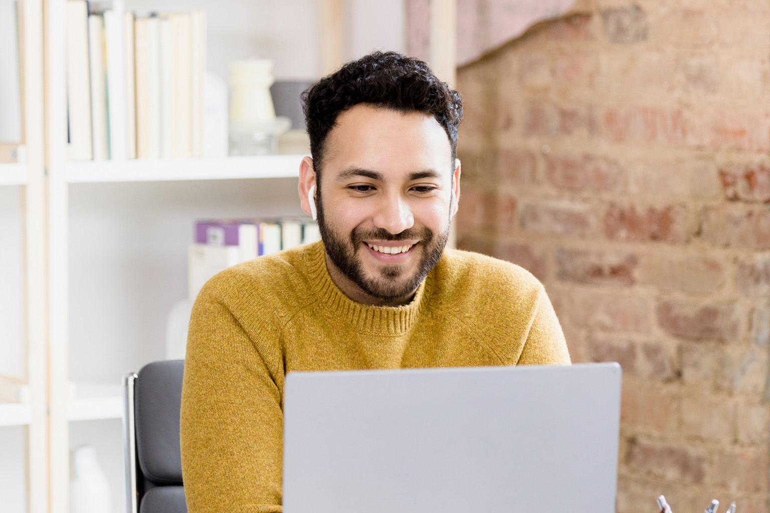 Professional looking at laptop