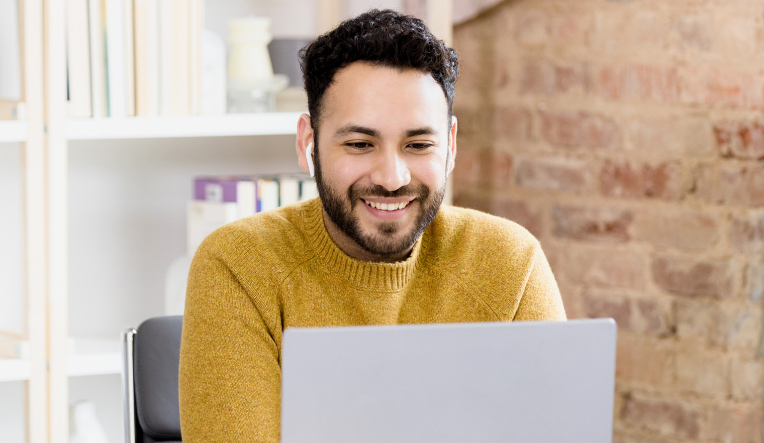 Professional looking at laptop