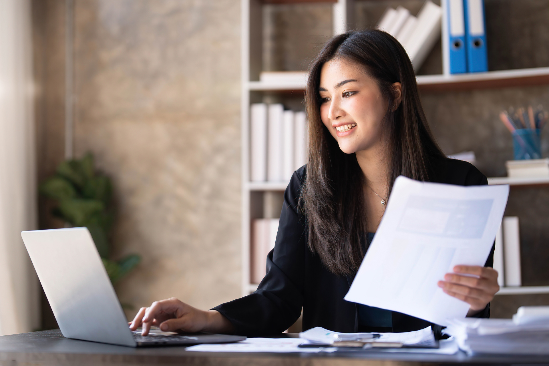 woman working at desk on laptop