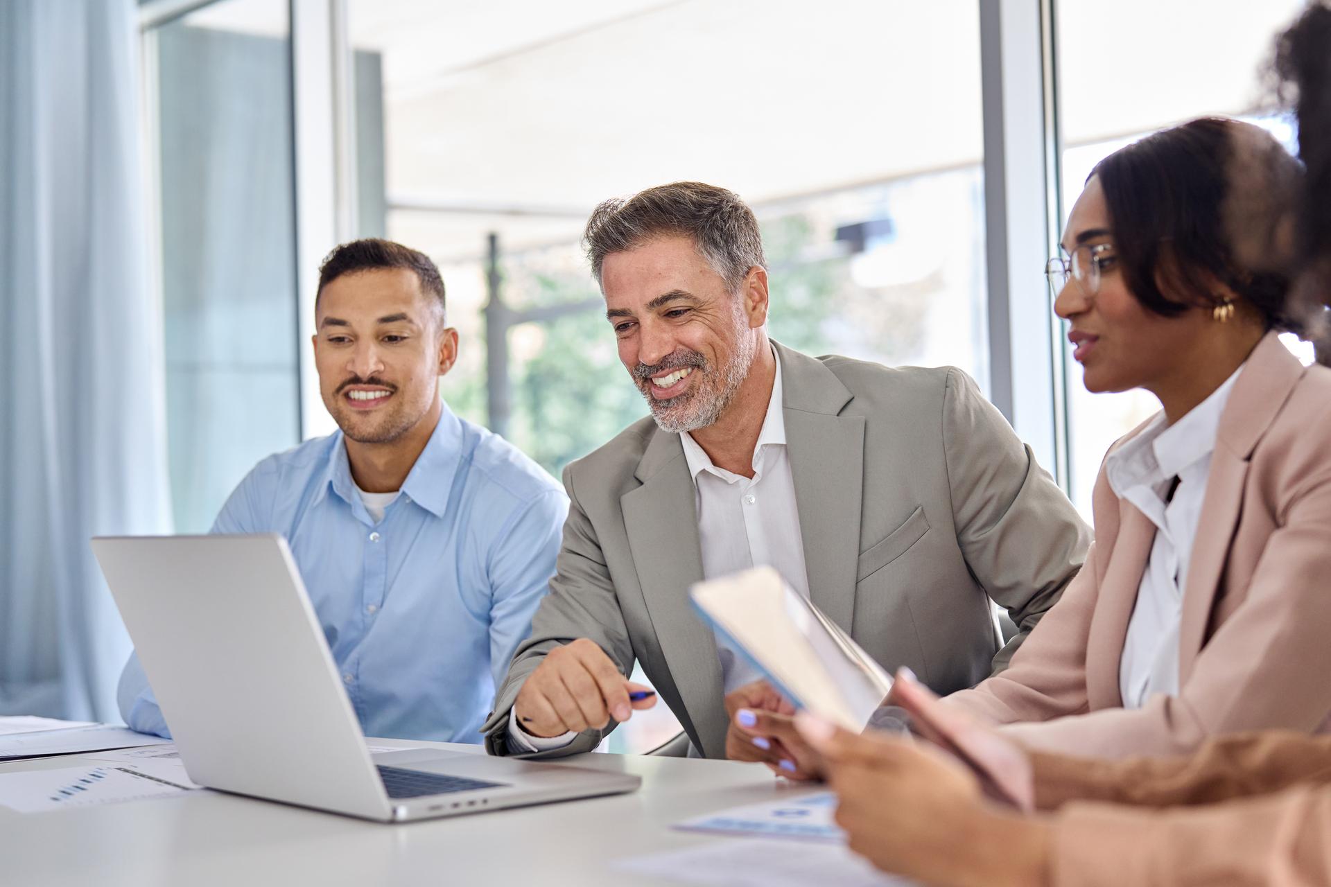 A team of people in an office working on lien compliance