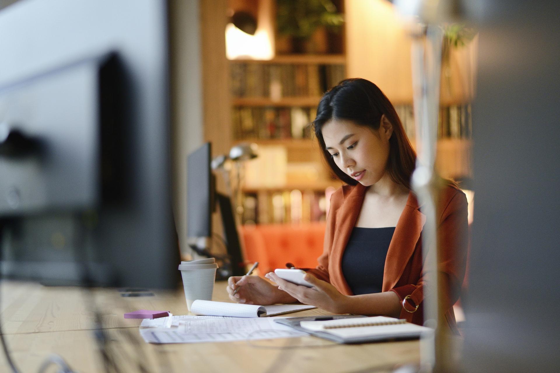 woman taking notes