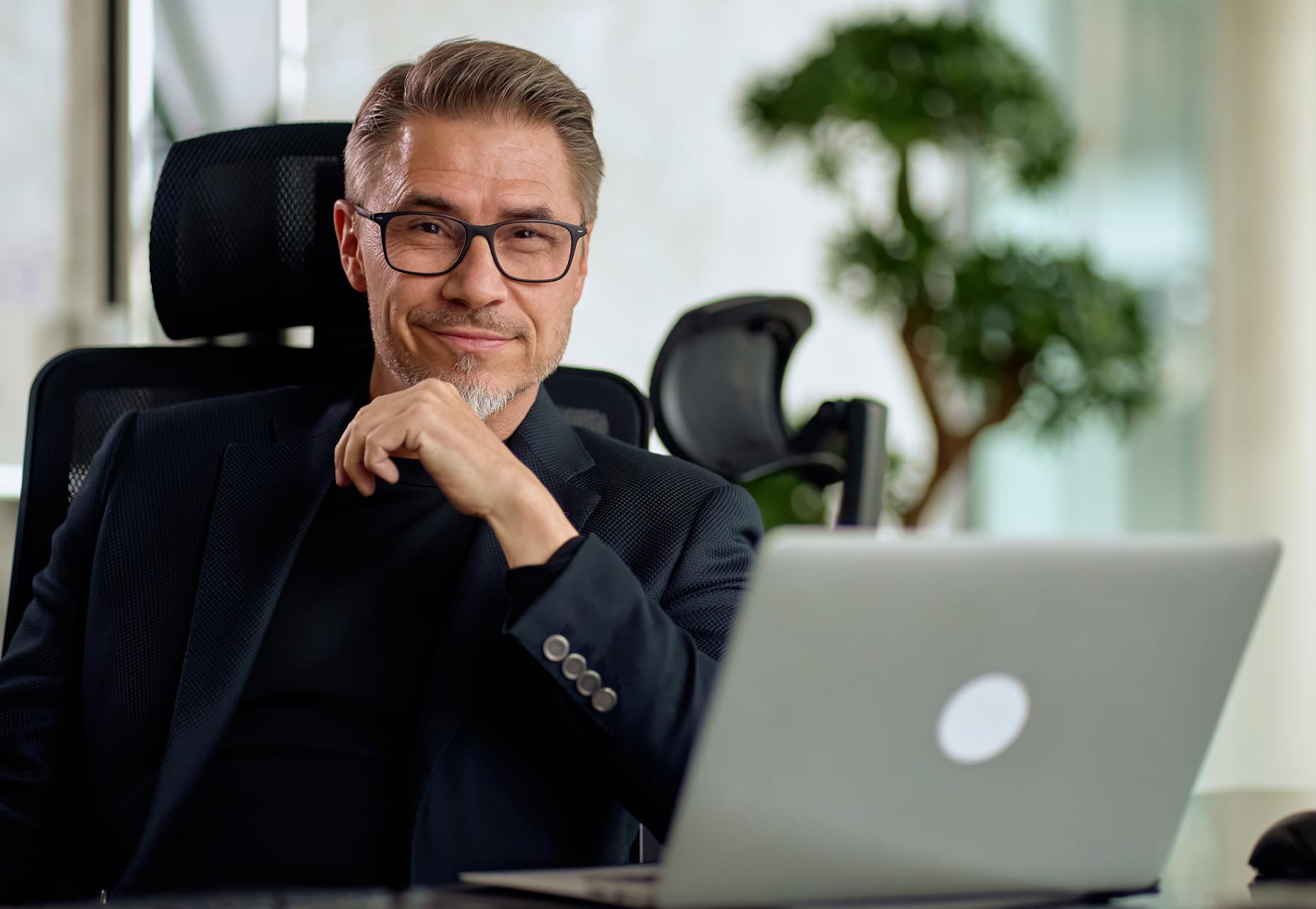 Confident businessman looking at camera