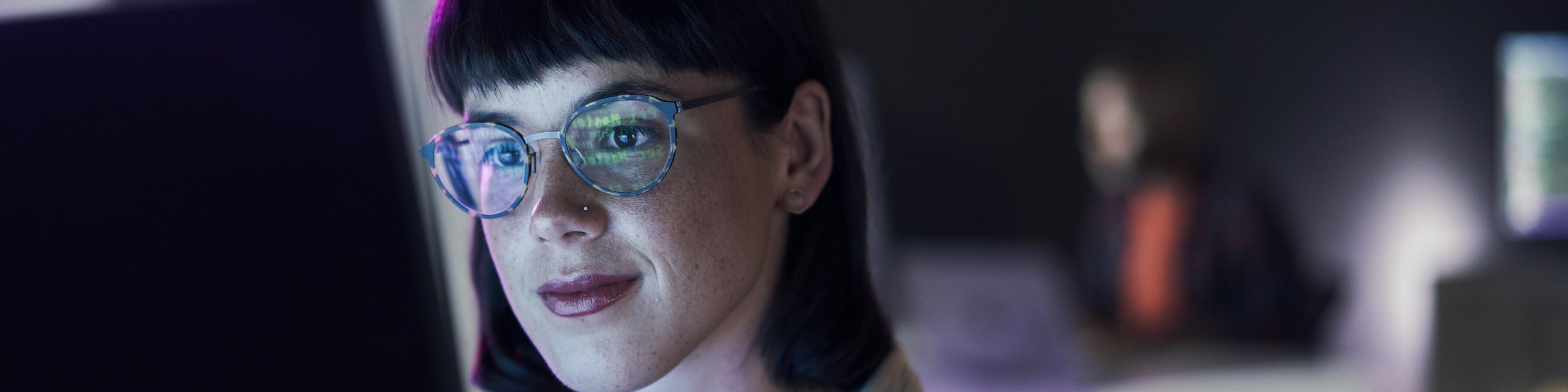 Professional woman working in front of a screen