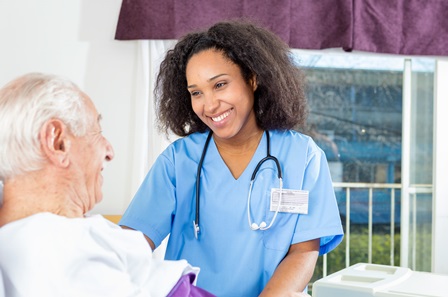 Nurse caring for old man