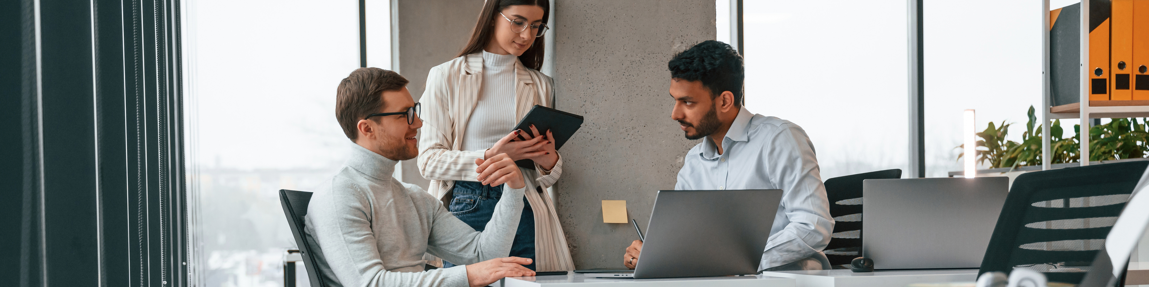 Men and woman are working in the office together