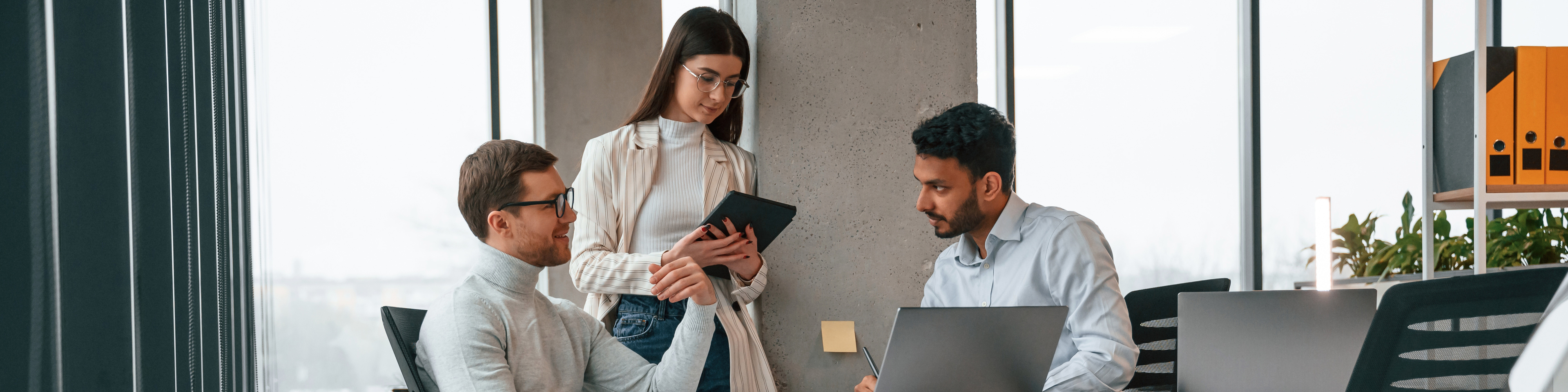 Men and woman are working in the office together