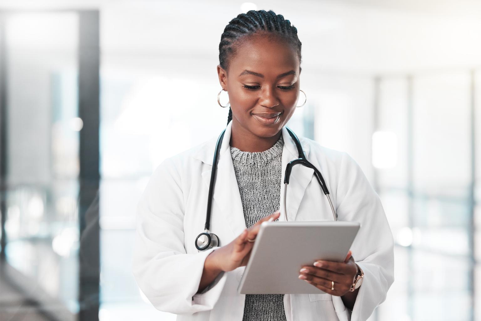 Female doctor using a digital tablet in a modern hospital