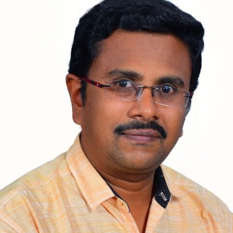 Professional headshot of Dr. Vimal.M.