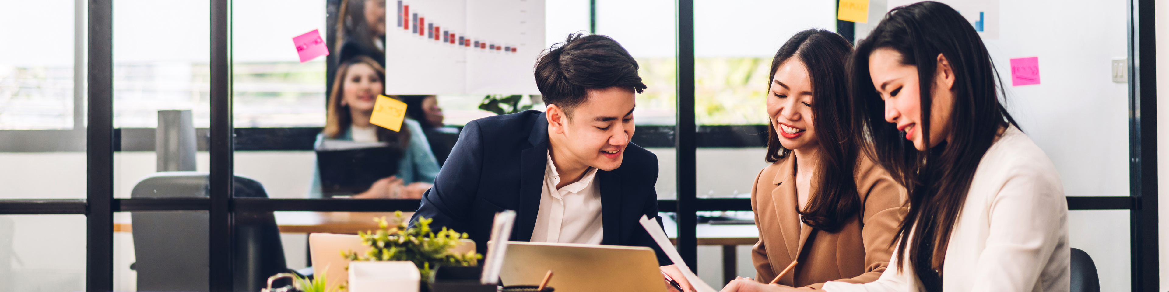 Business people planning and brainstorming with laptop