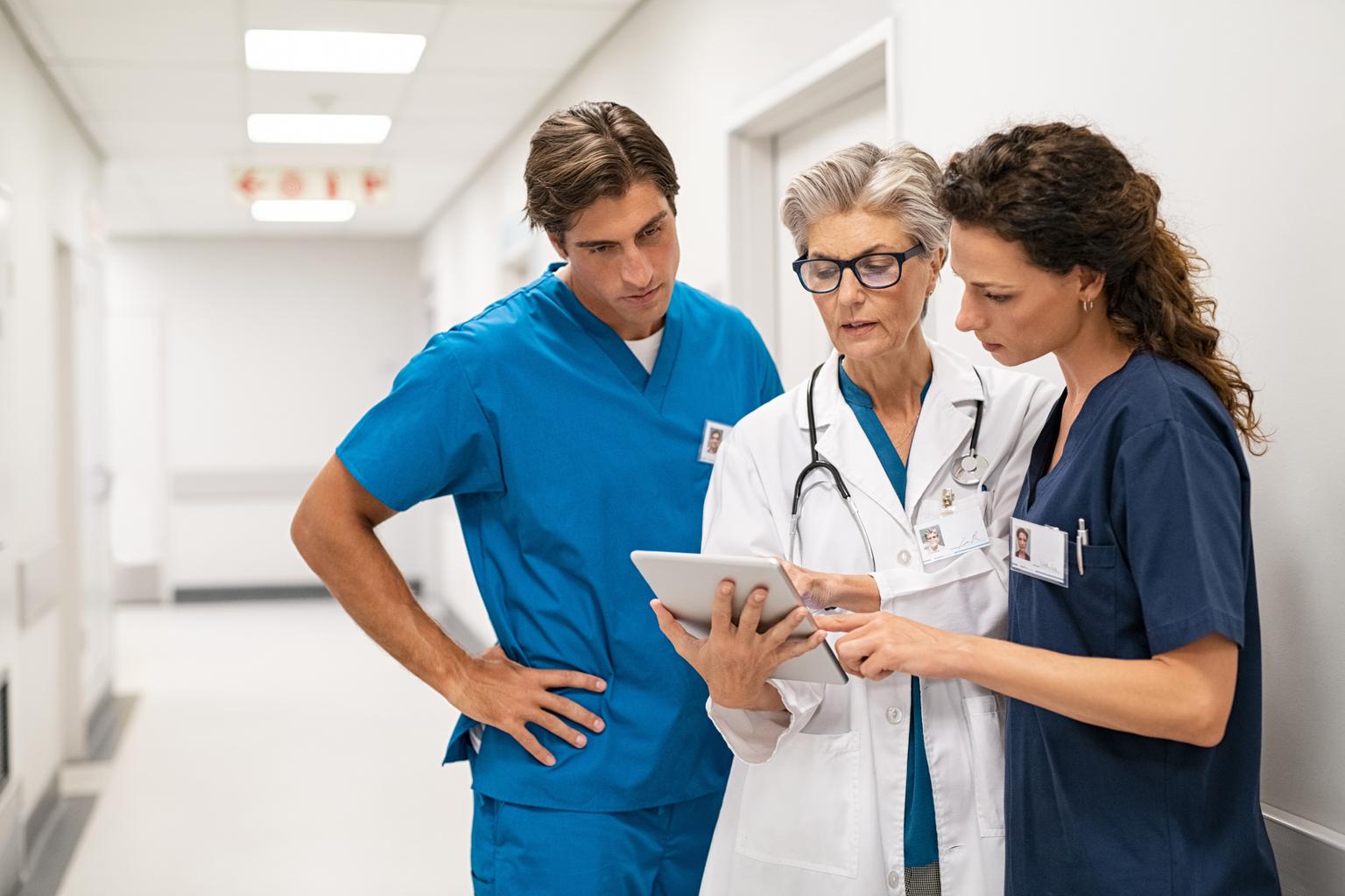  A doctor and nurse discussing a patient's case in a hospital setting