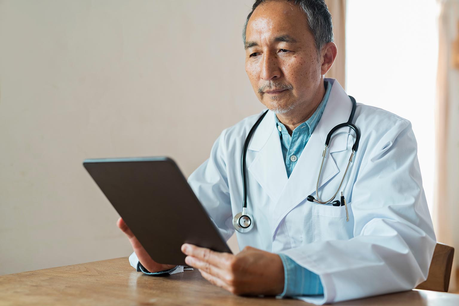 doctor on tablet