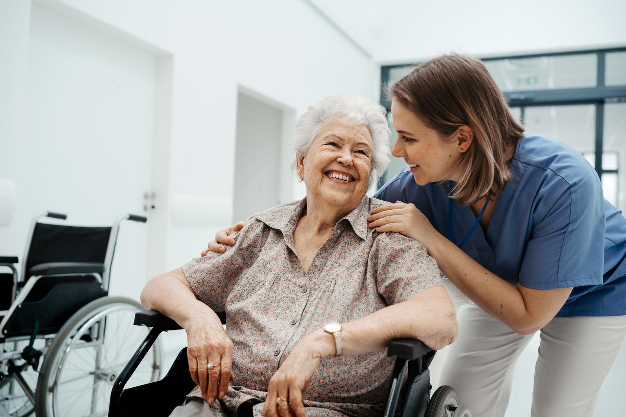 Nurse in rural clinic helps care for senior patient in a wheelchair