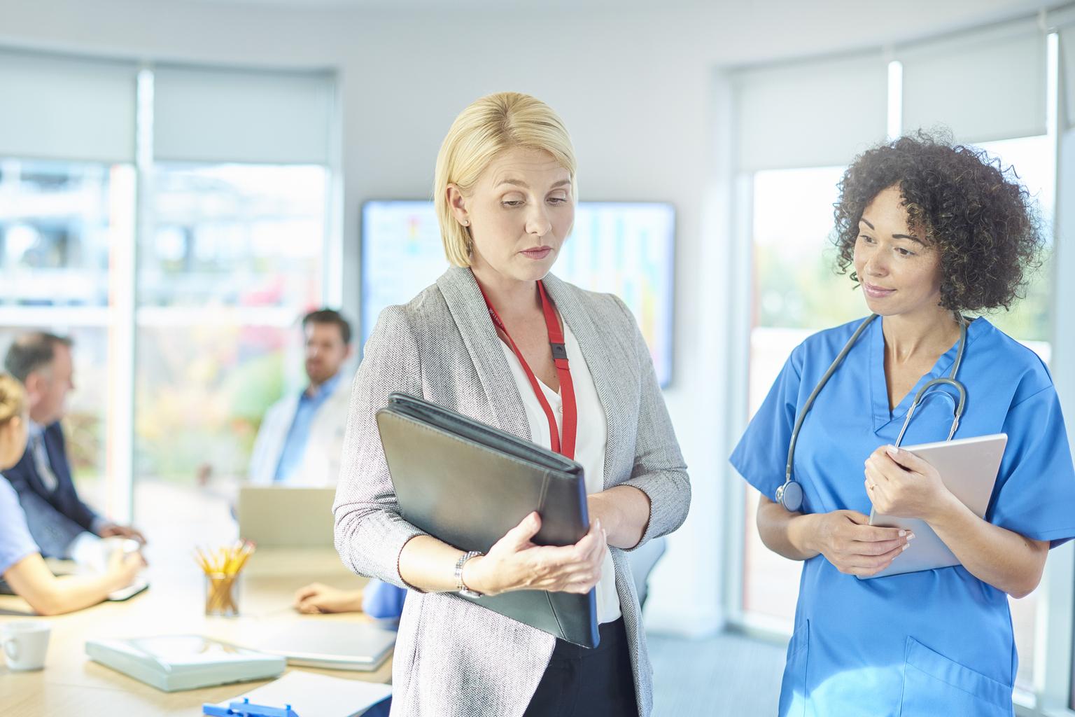 Healthcare professionals gathered in sunny conference room