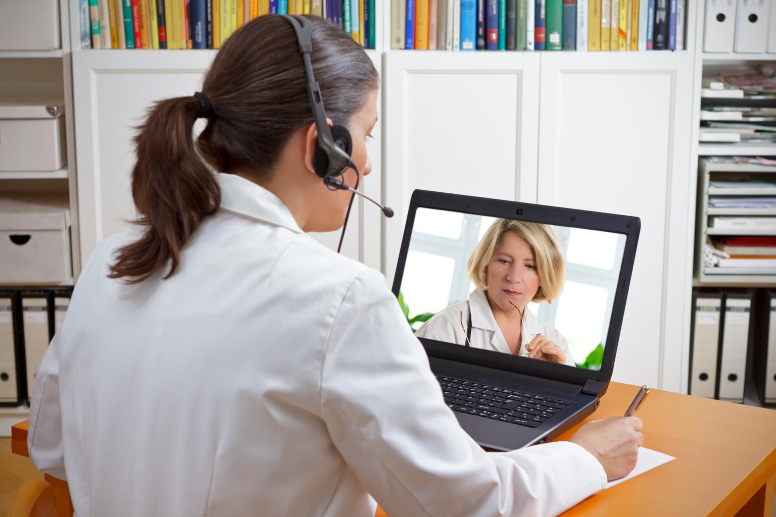 Female doctor having a video conference about examination results with another doctor