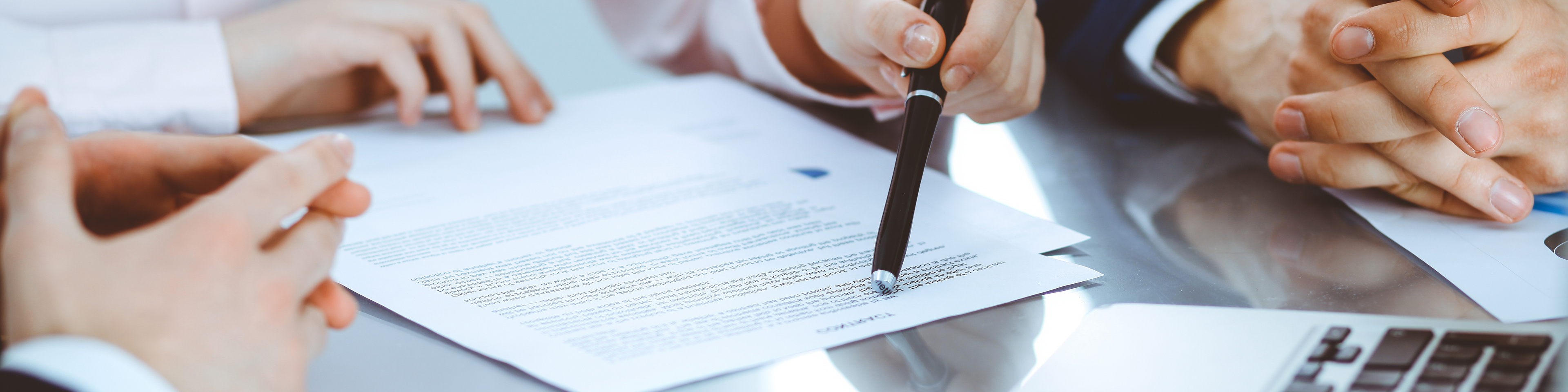 Group of business people and lawyers discussing contract papers