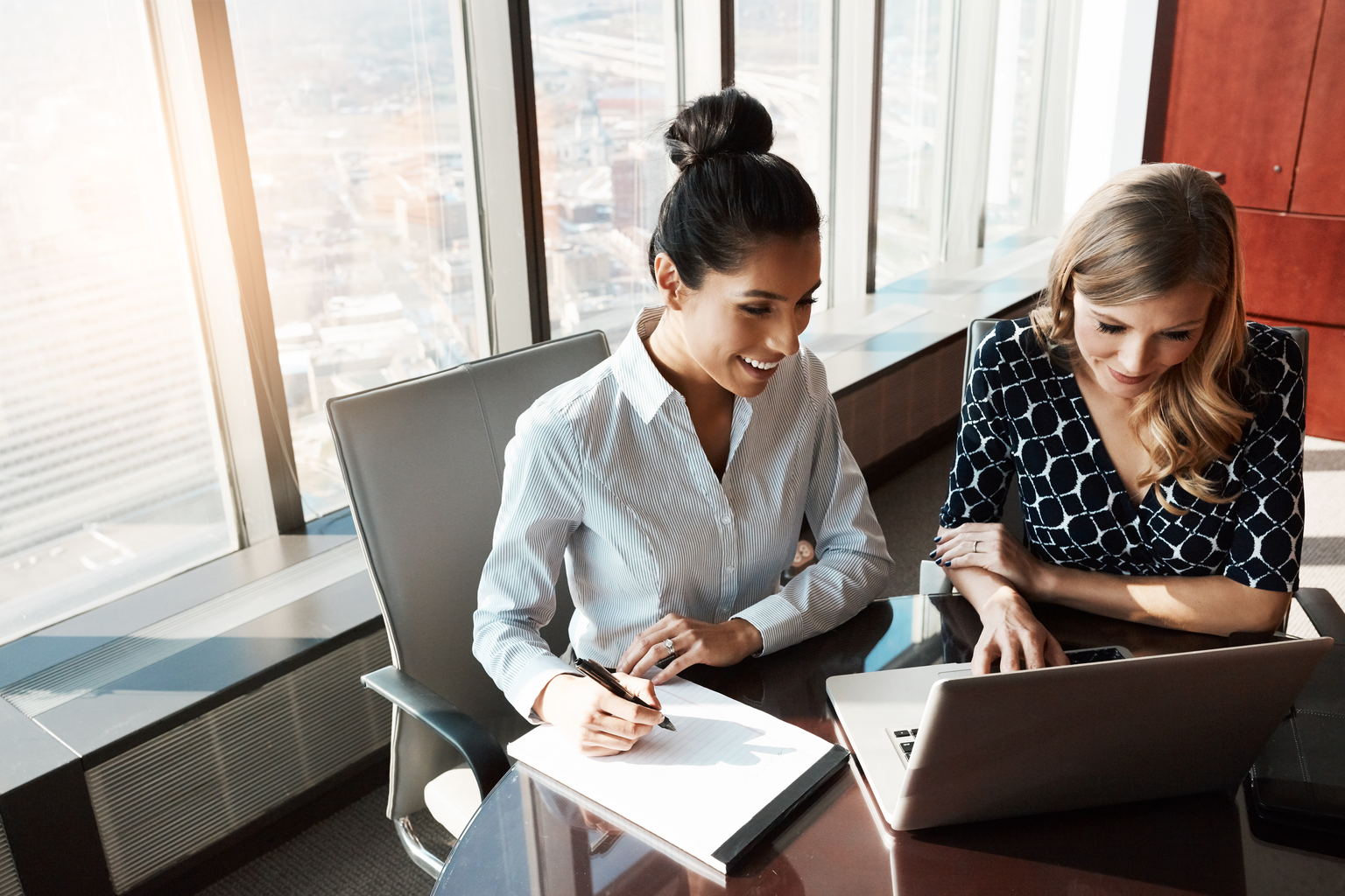 Two women working in office