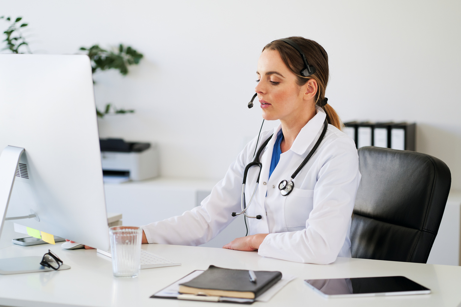 Female doctor talking during telehealth virtual visit appointment