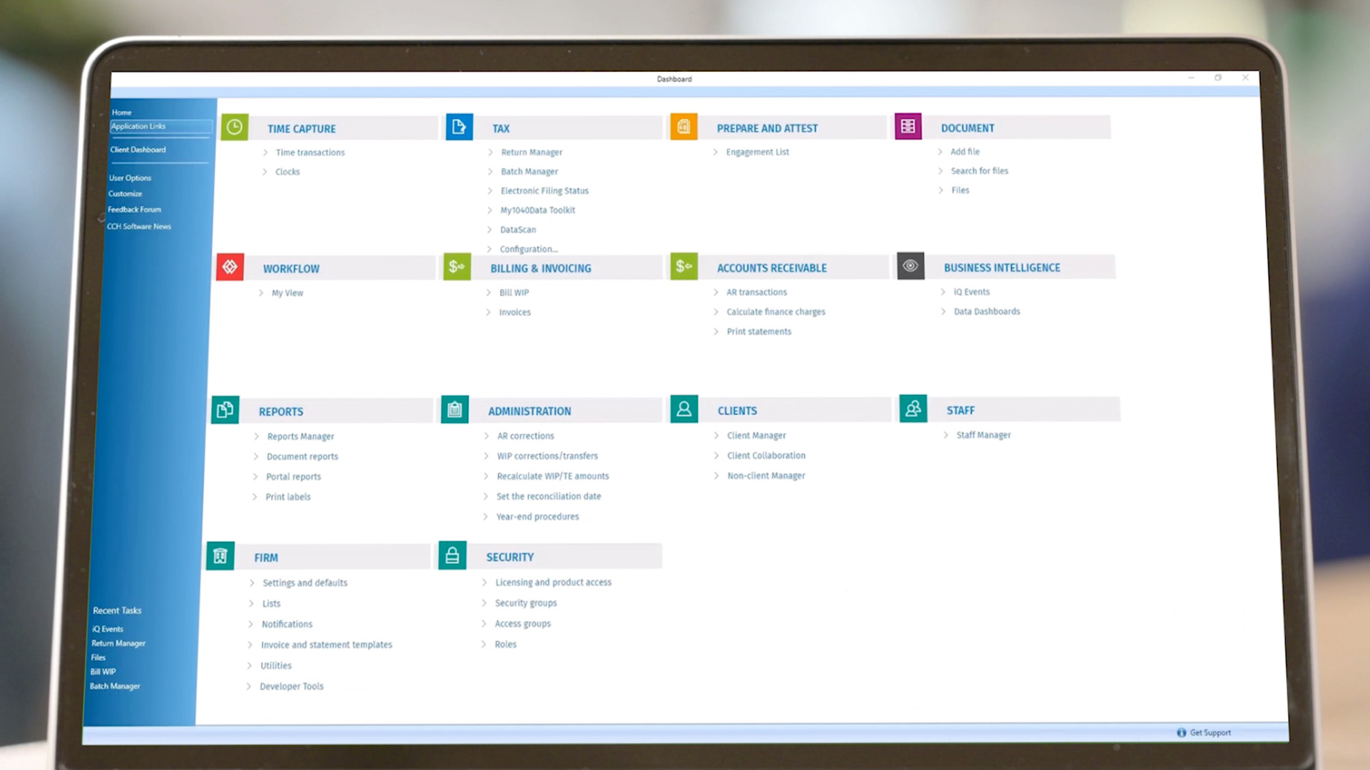 The CCH Axcess application dashboard screen displayed on an open laptop