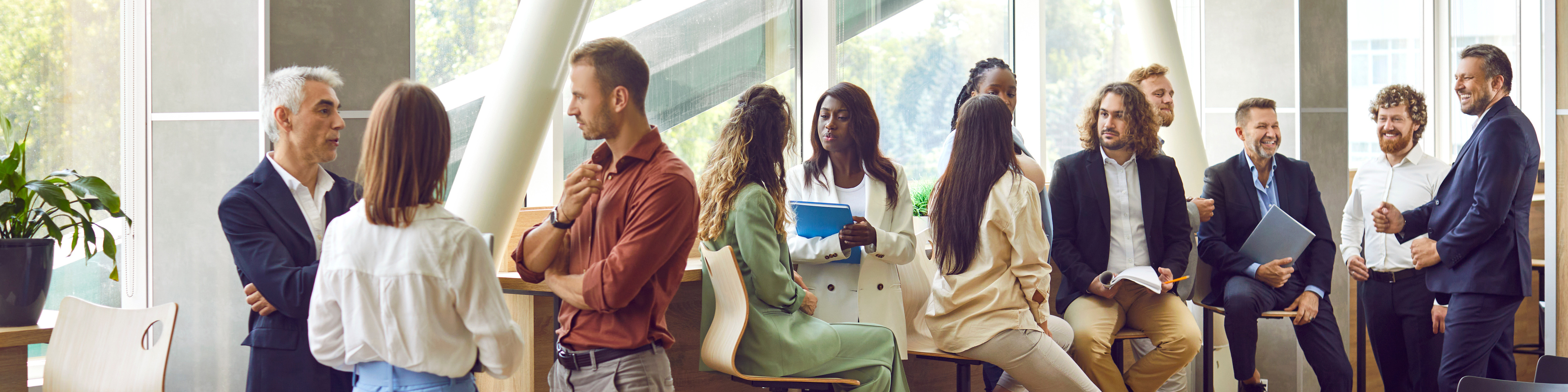 Diverse business professionals communicating at a conference