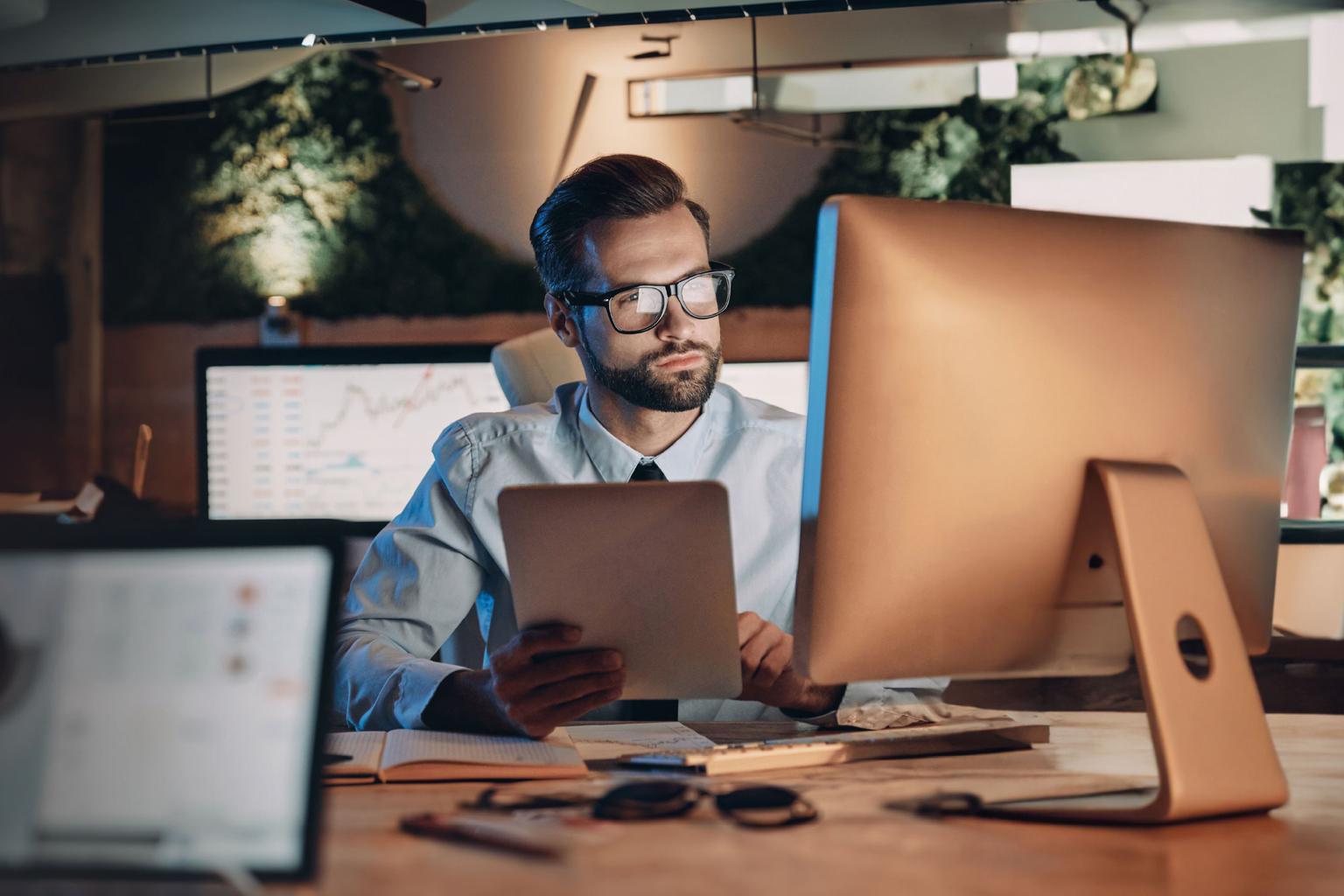 Confident young man working on computer