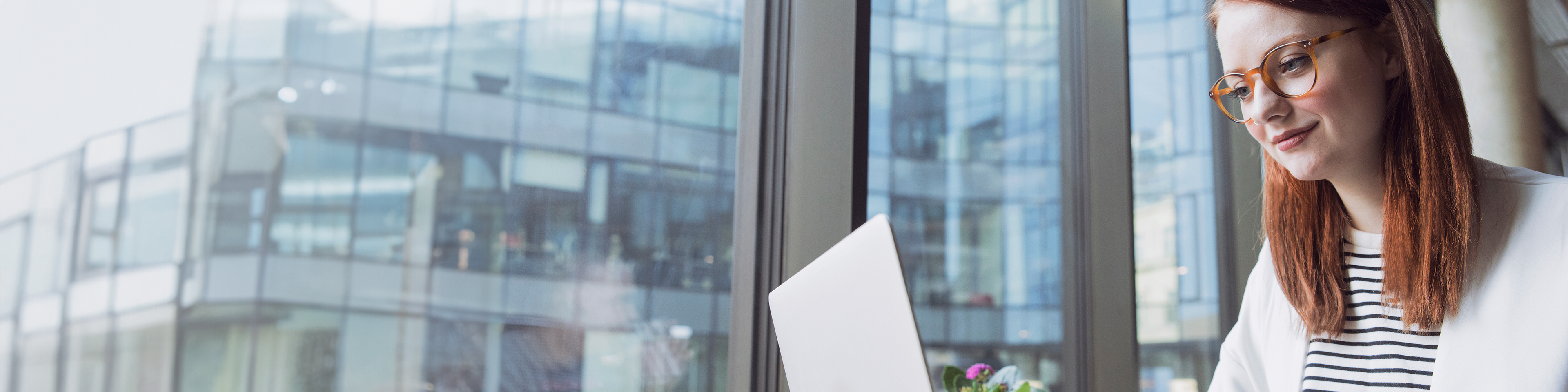 woman using laptop to explore uk market insights