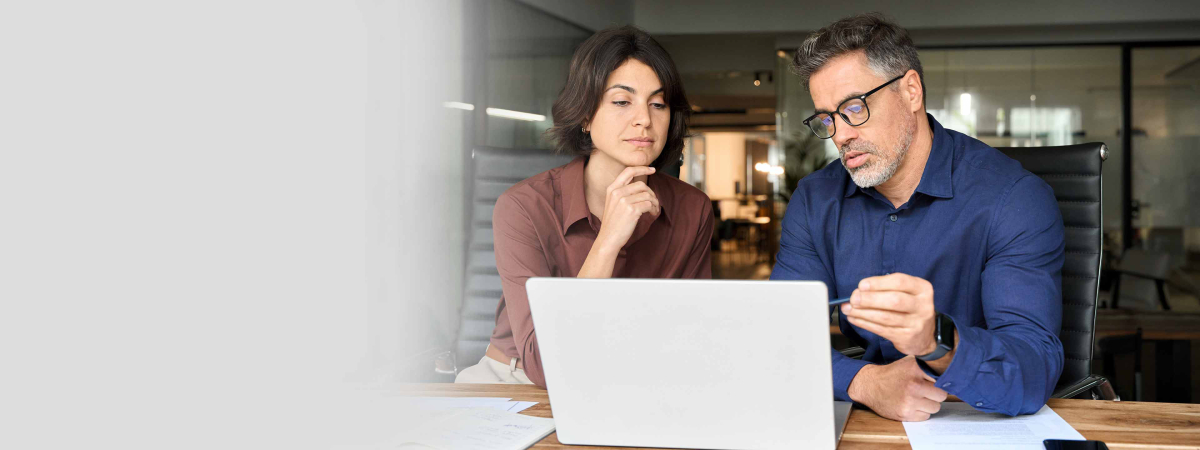 people working in front of a laptop