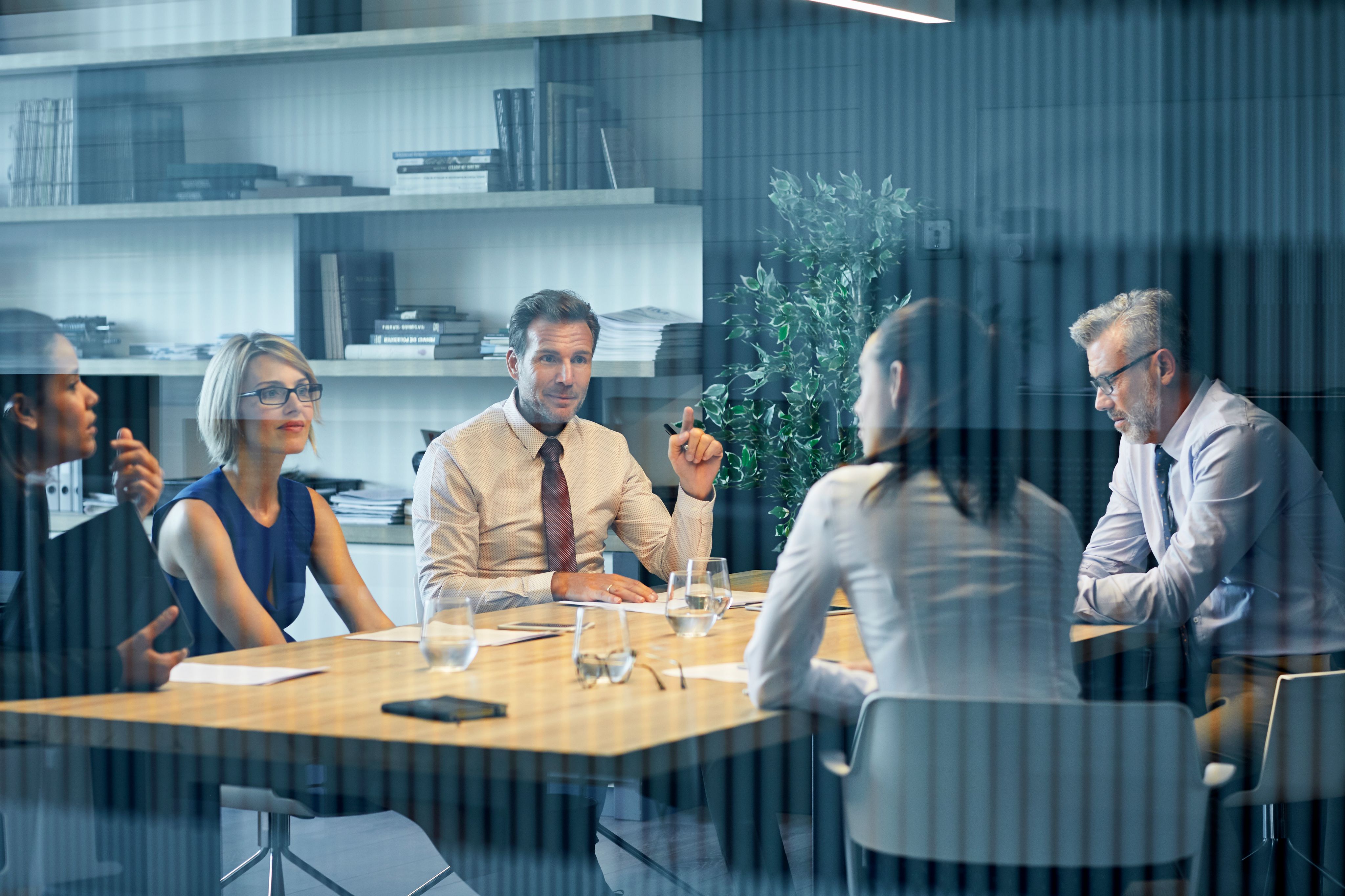 People sitting at a desk having a meeting