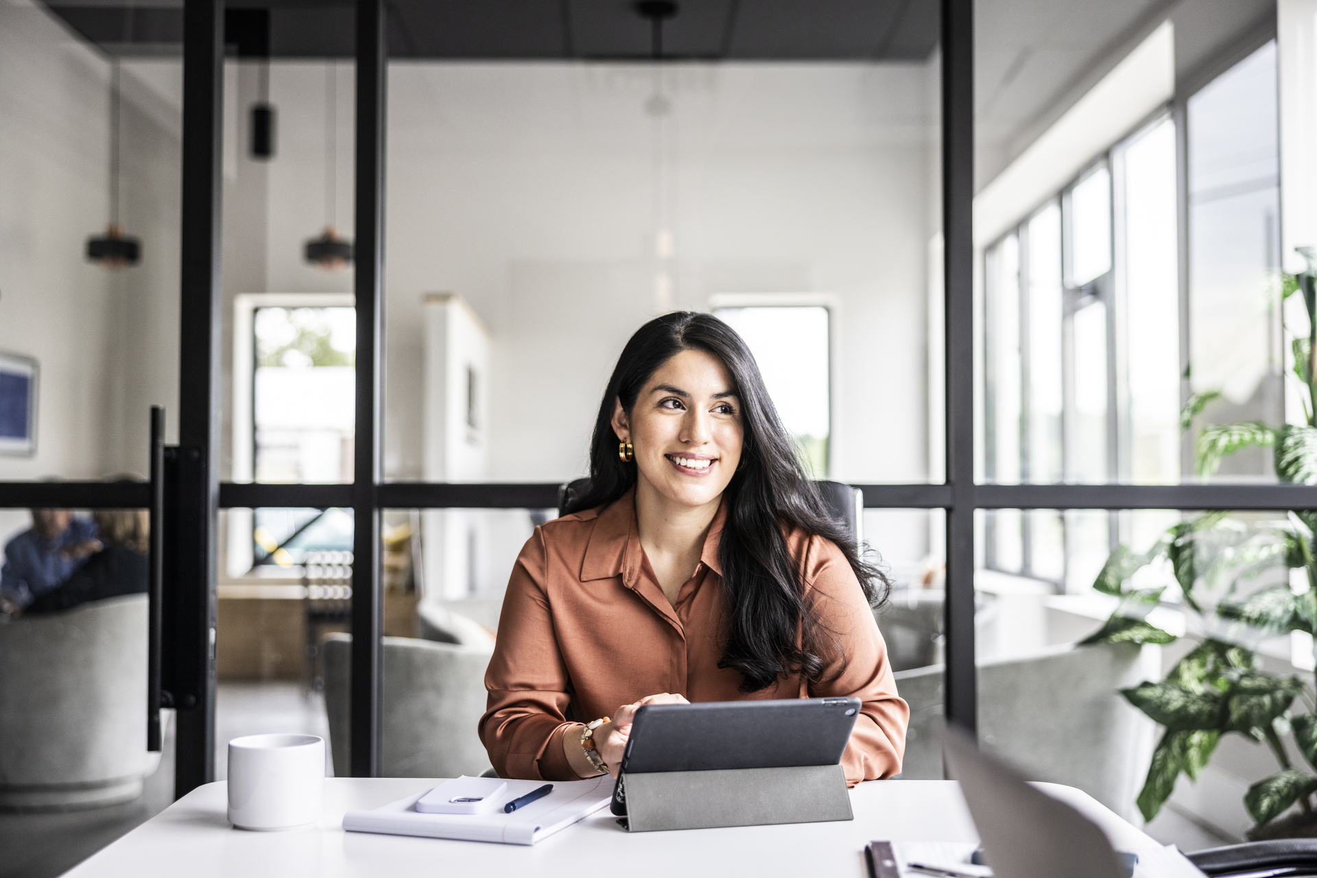 Portrait of businesswoman in modern conference room