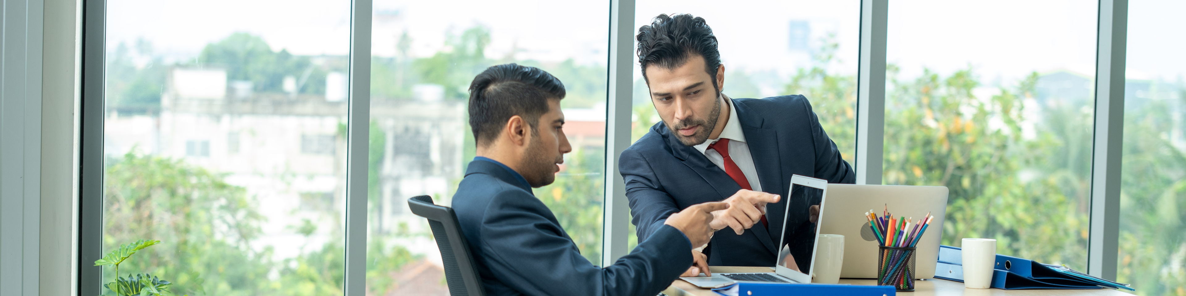 Business people having meeting around table