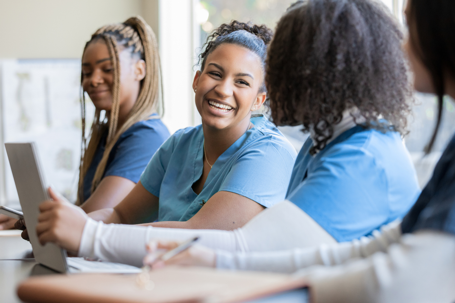 Nursing students prepping for NCLEX in a sunny classroom