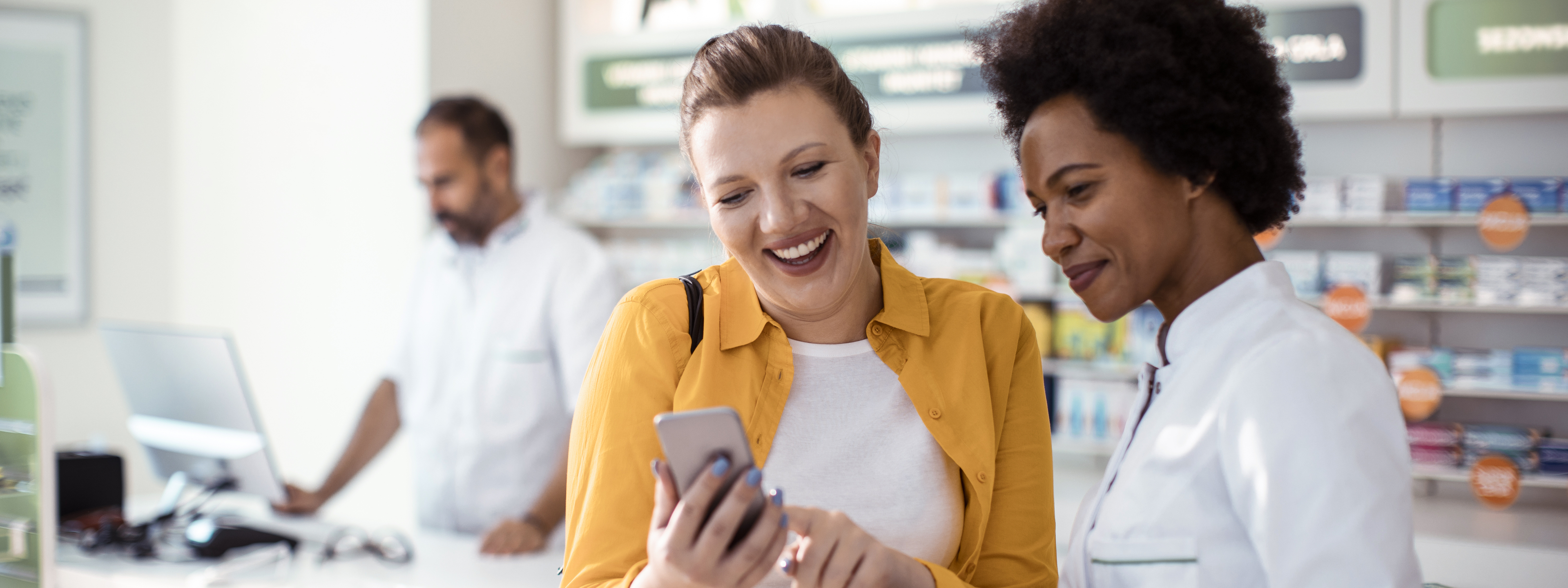 Female pharmacist providing consultation to female customer