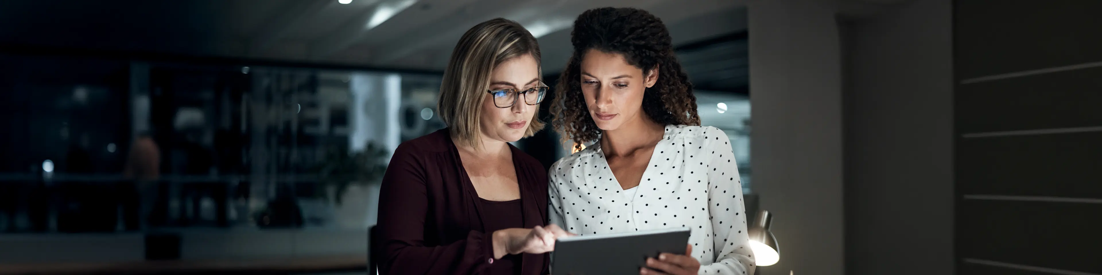 Two women looking at ipad