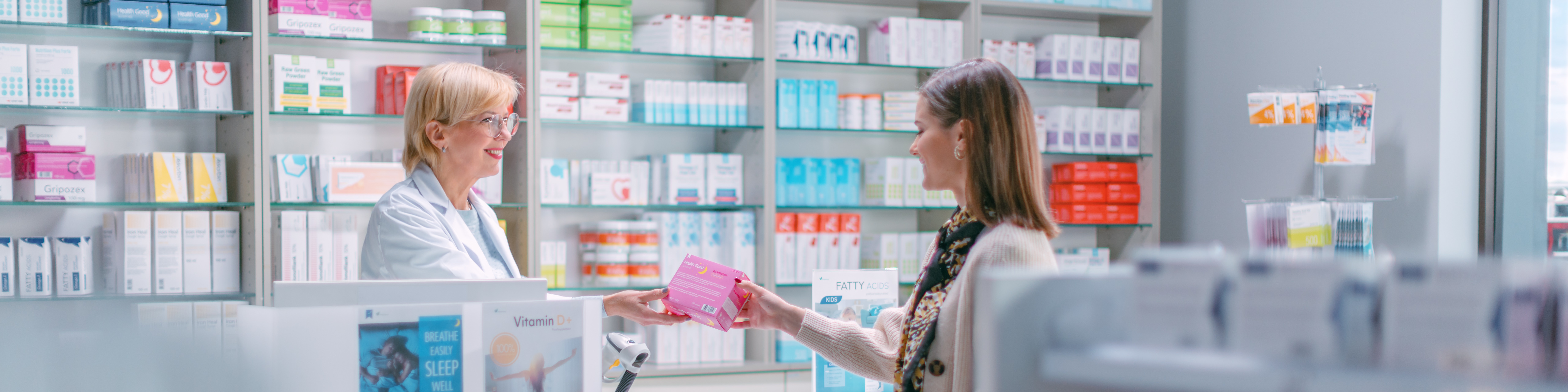 A pharmacist helping a customer in a pharmacy