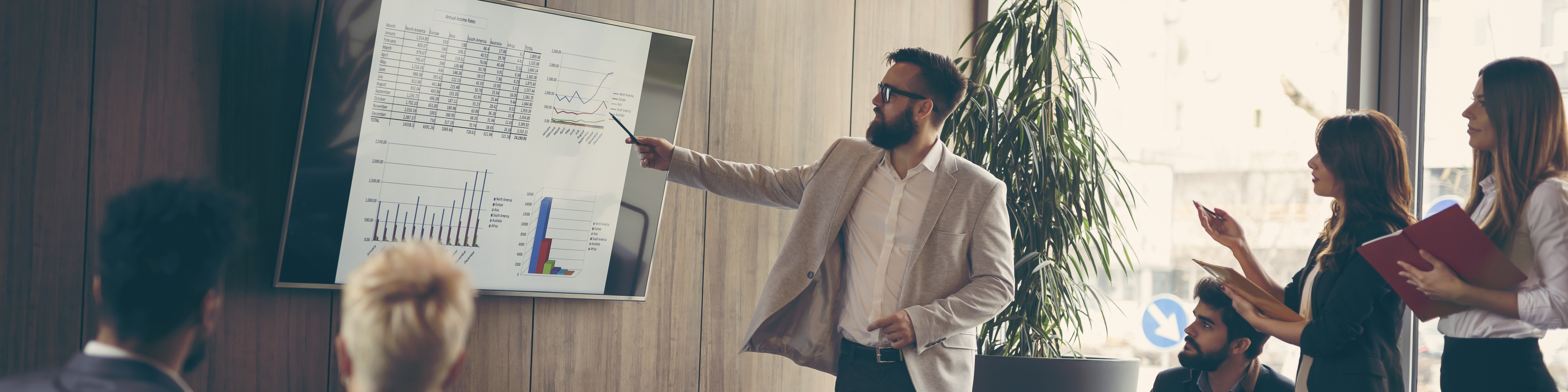 Business team on a morning briefing; business meeting and presentation in a modern office