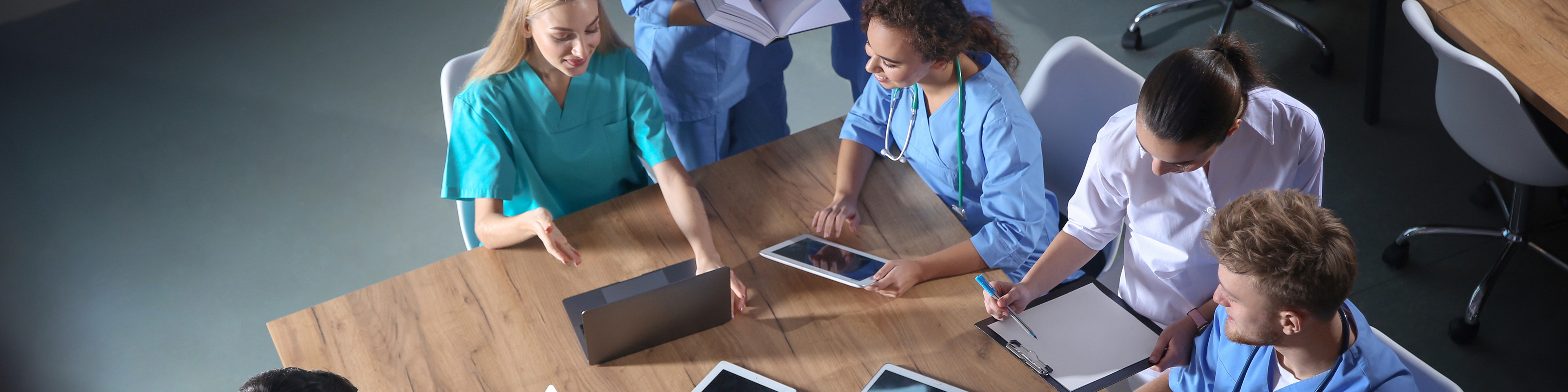 Group of medical students with gadgets in college