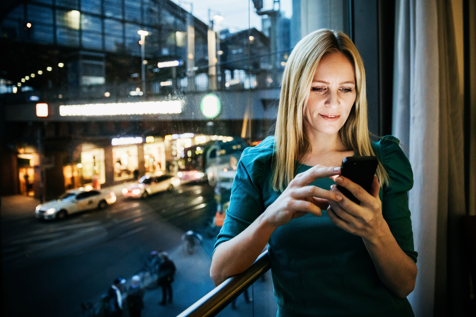 Businesswoman Networking Using Her Smartphone