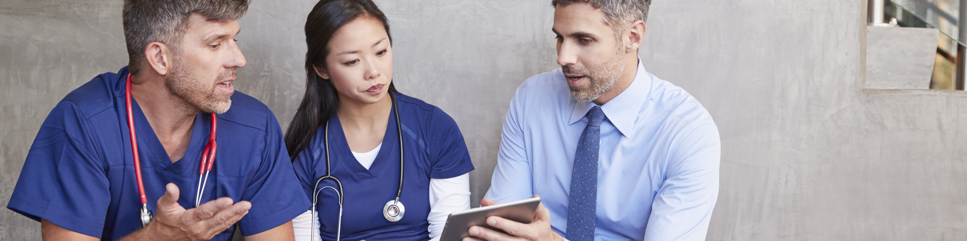 Doctors sitting on a bench talking