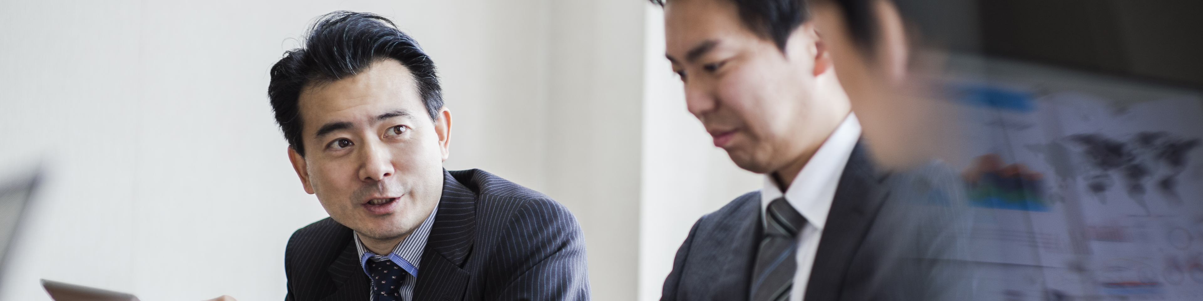 Three businessmen meeting in a conference room