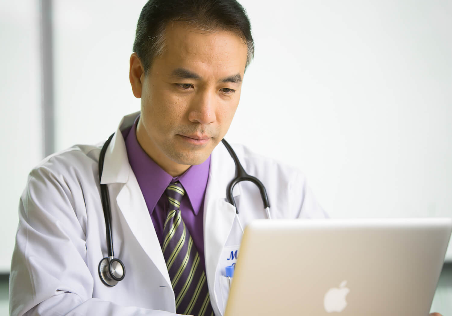 clinician on a laptop