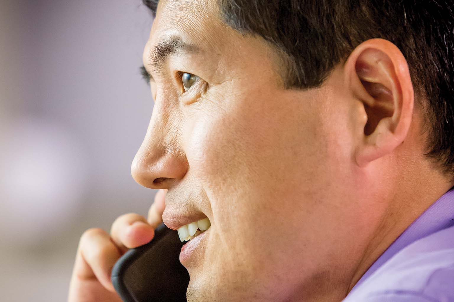 closeup of businessman talking on smartphone