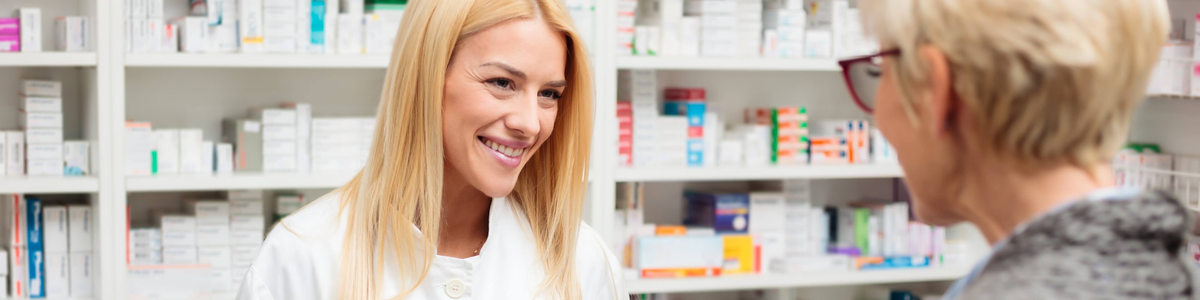 Pharmacist speaking with a customer
