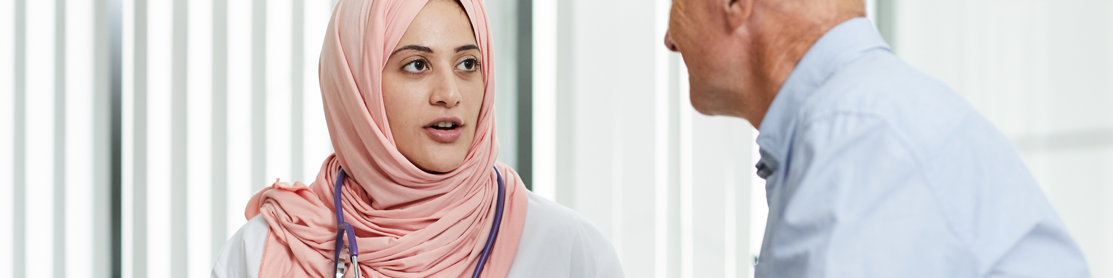 Middle-Eastern doctor talking to patient