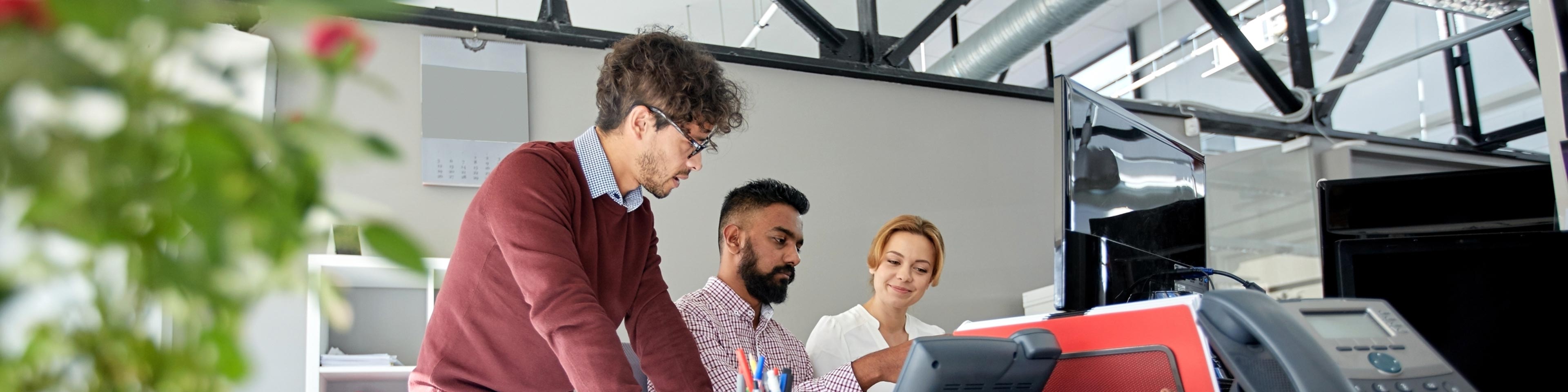 team of employees studying further education