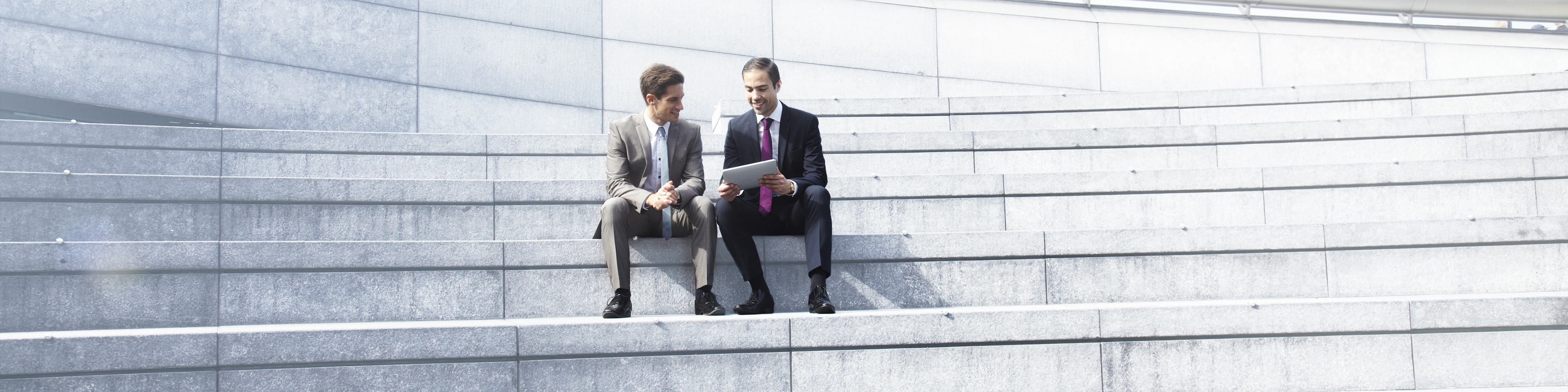 Two businessmen working in a tablet. 