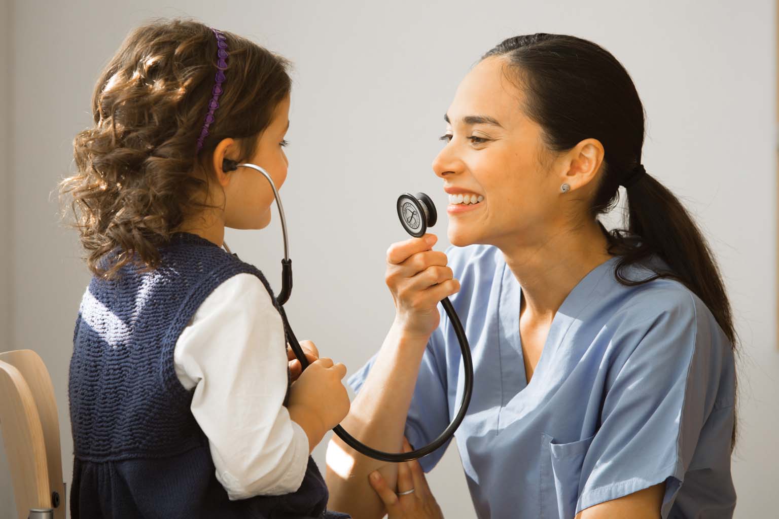 resident with child and stethescope