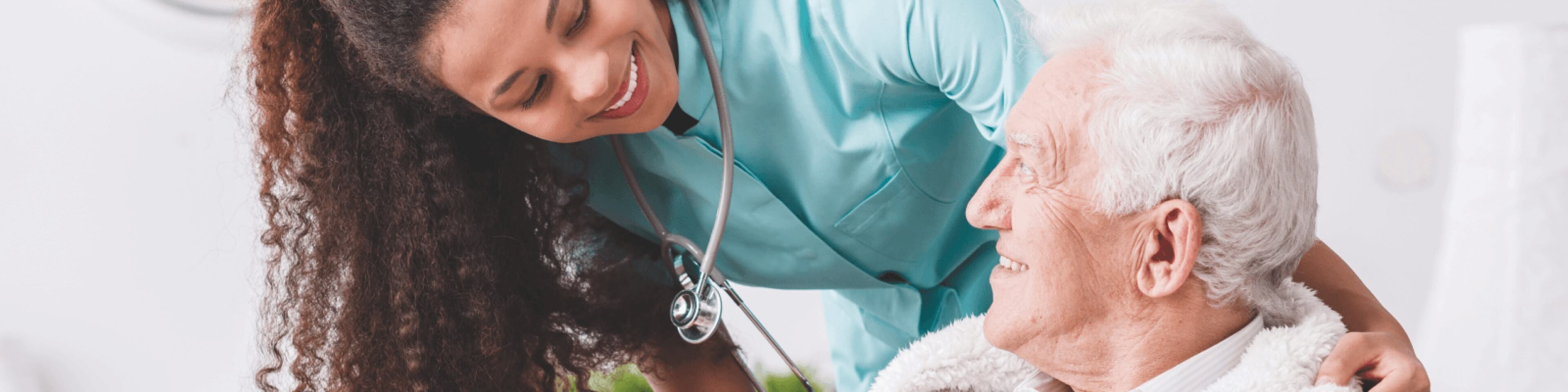 Friendly nurse speaking with an older patient