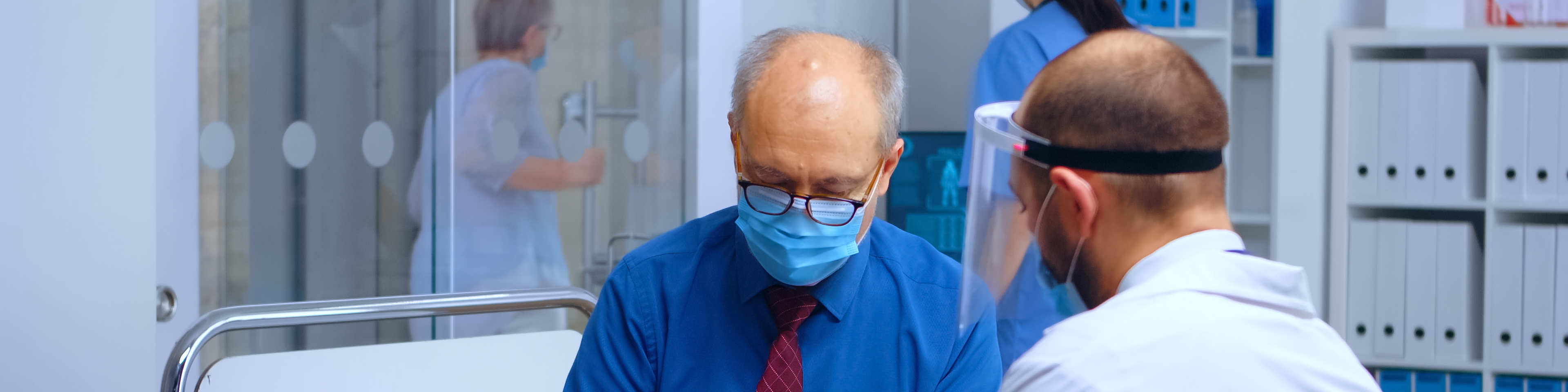 Patient wearing protection mask and signing the discharge form, covid-19 medical healthcare consultation