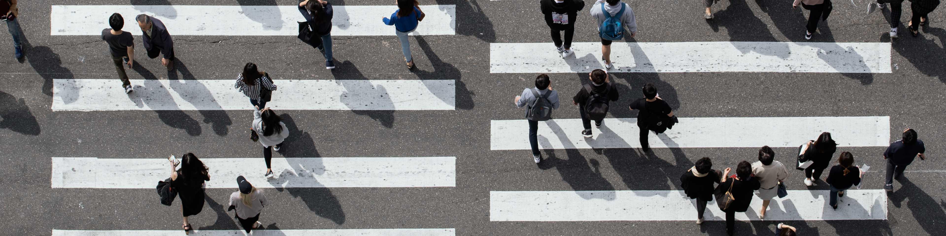 Overhead view of people crossing crosswalk